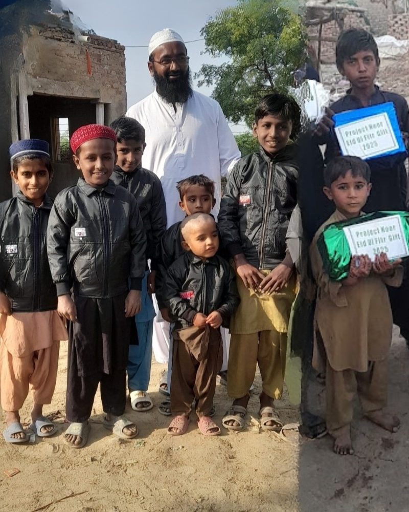 Volunteers distributing Project Noor Eid gift packs